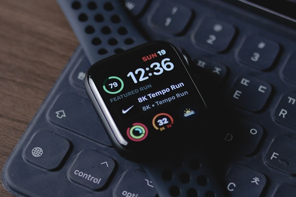 black smart watch on black computer keyboard